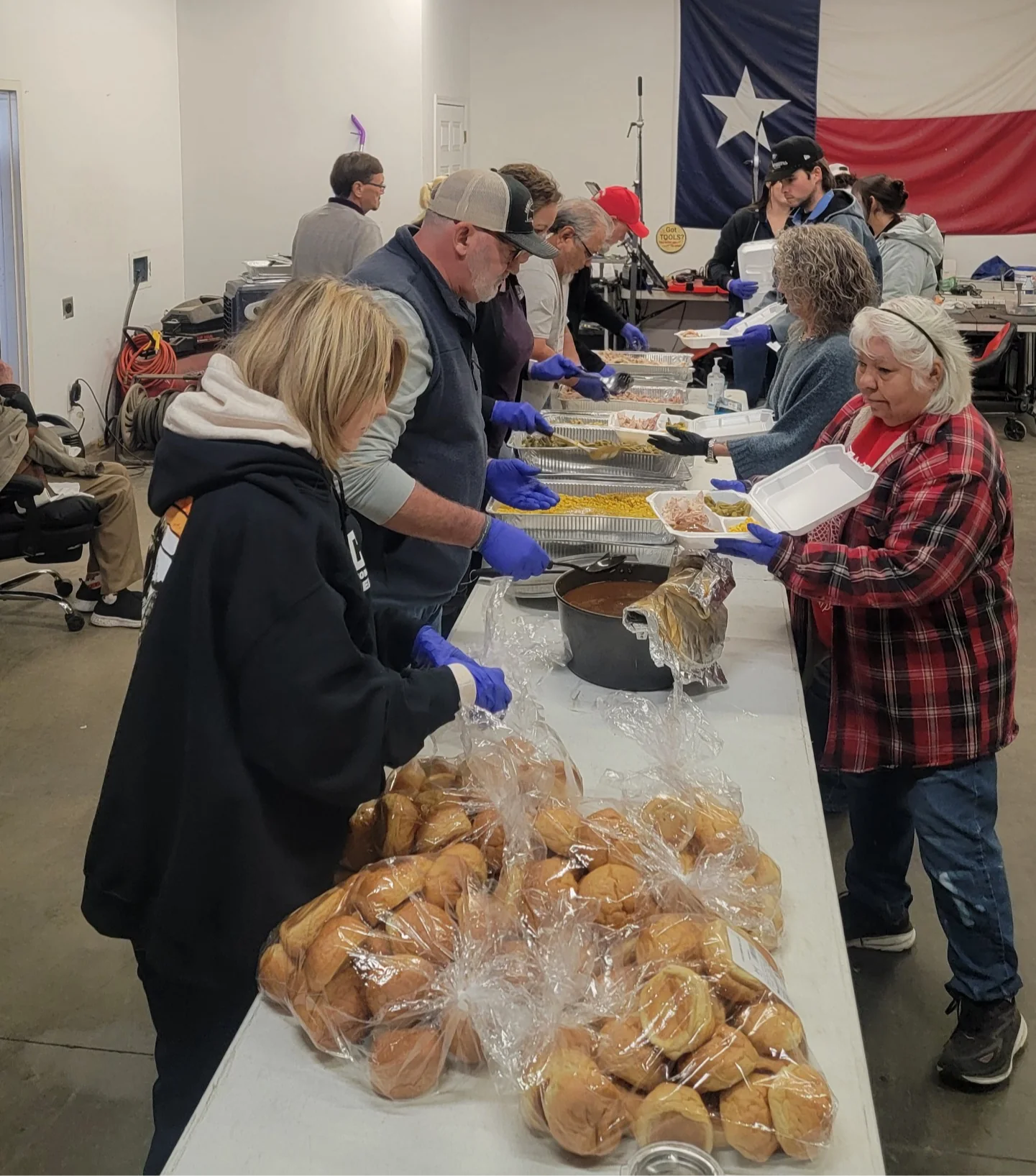 Community members sharing a meal around a table