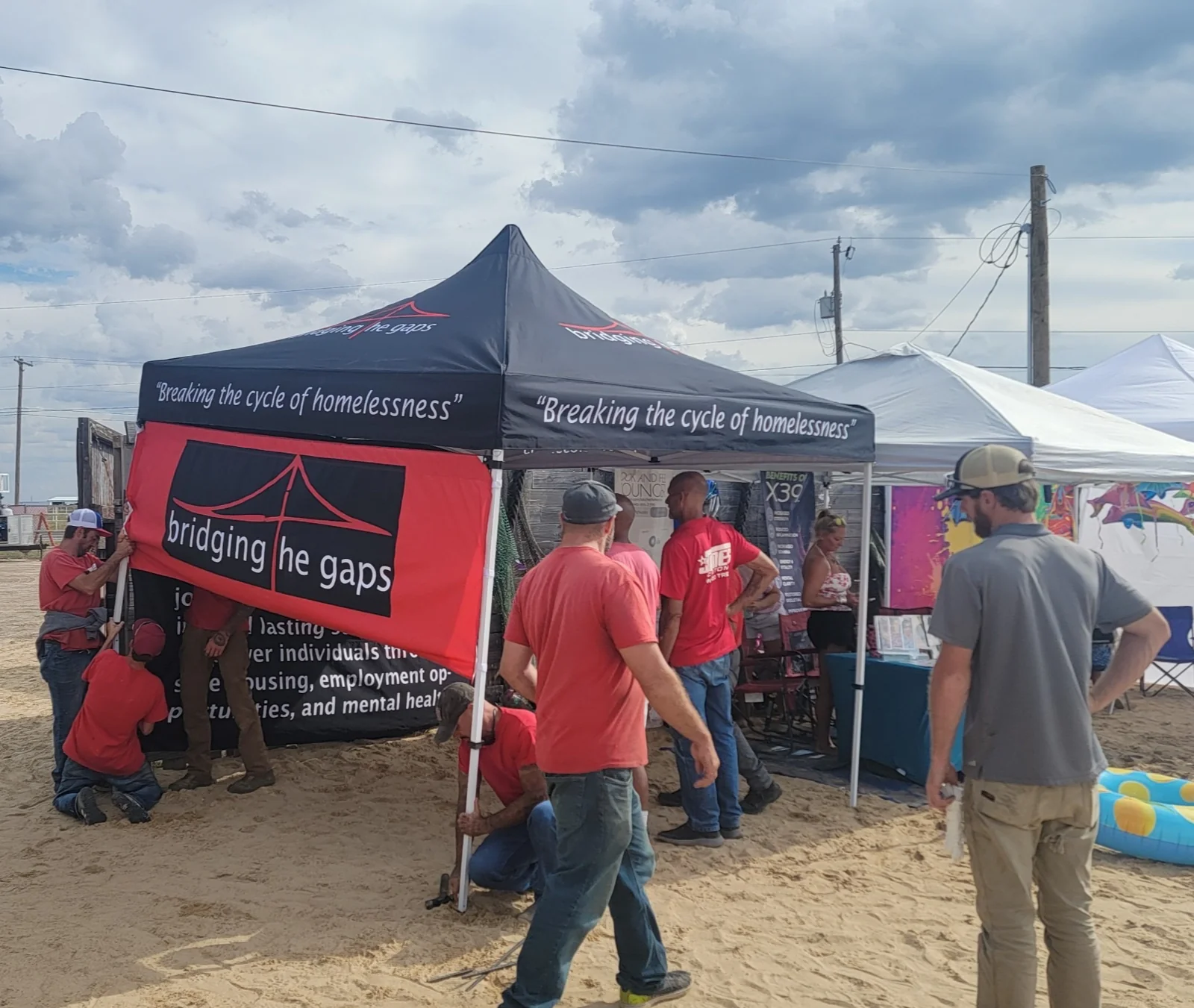 Community outreach at a Bridging the Gaps tent